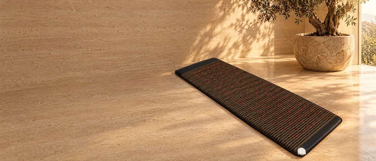 The Synergy Mat on a travertine floor in golden light